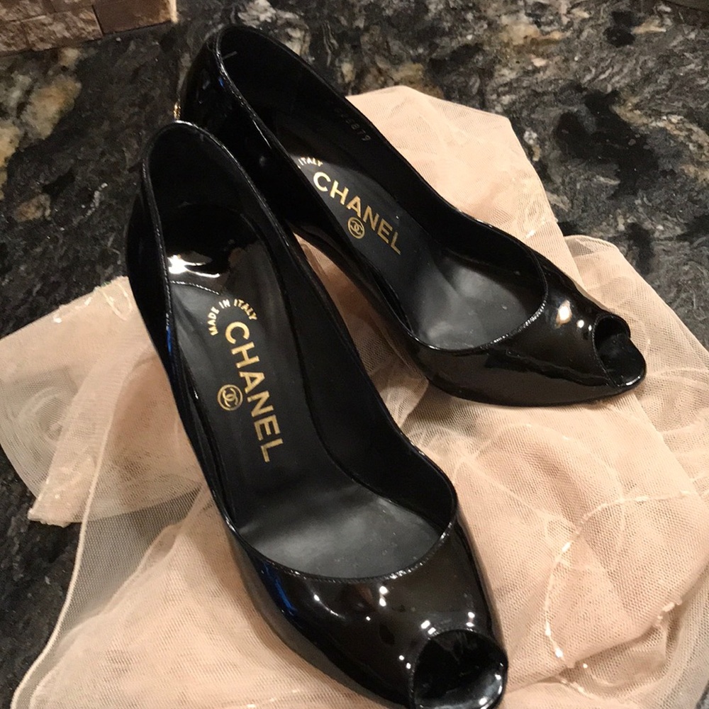 CHANEL black patent heels.
